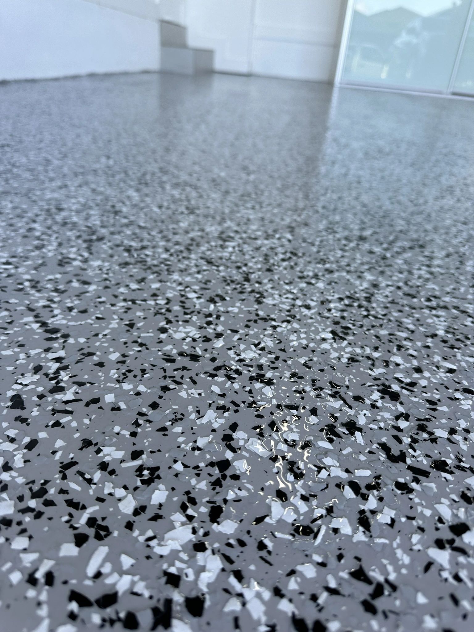 Macro view of black, grey and white epoxy flake