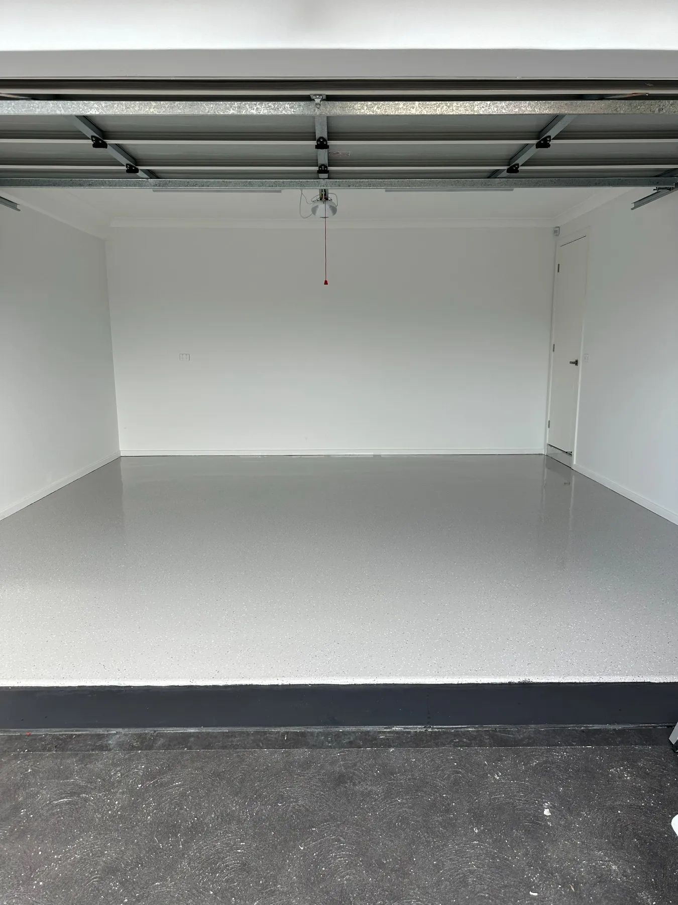 The same garage finished in epoxy after grinding