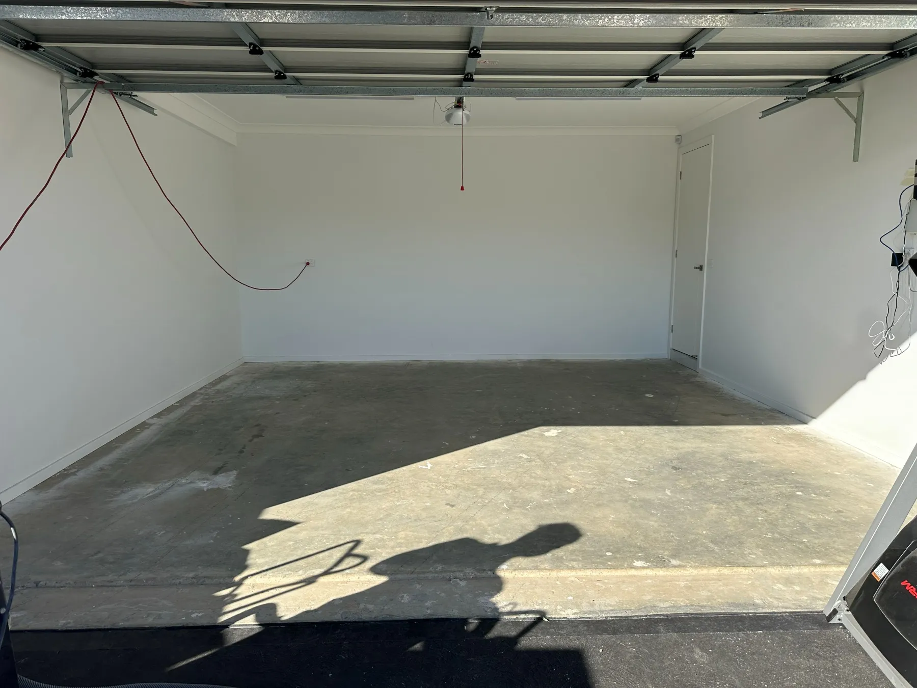 Bare garage slab before grinding