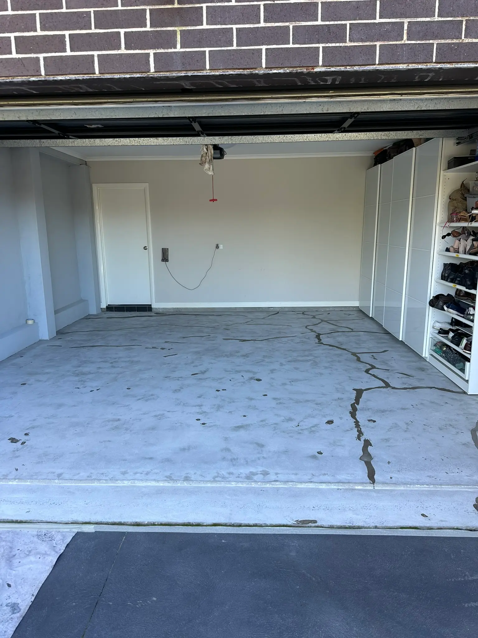Cracked garage floor before epoxy coating