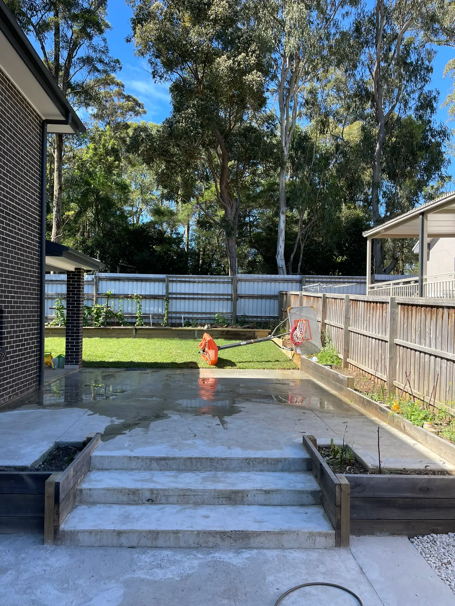 Plain concrete backyard slab and steps in West Pennant Hills before resurfacing