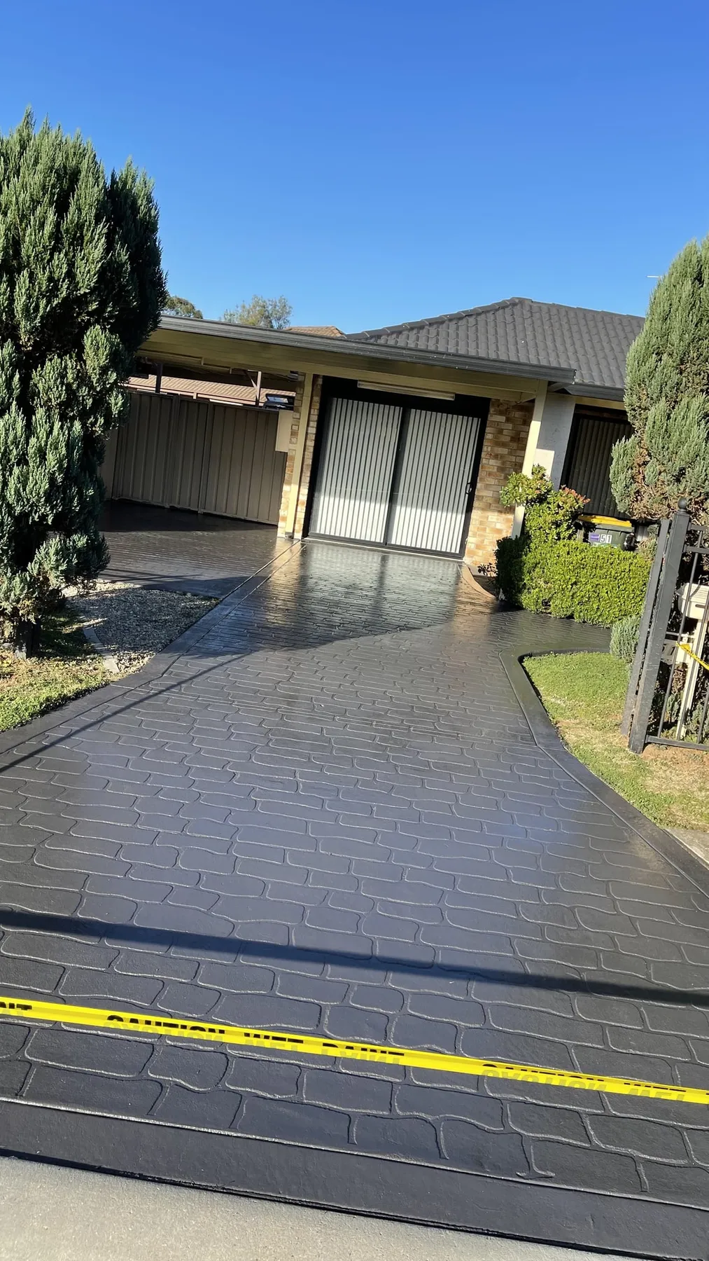 The same driveway after colour sealing in charcoal
